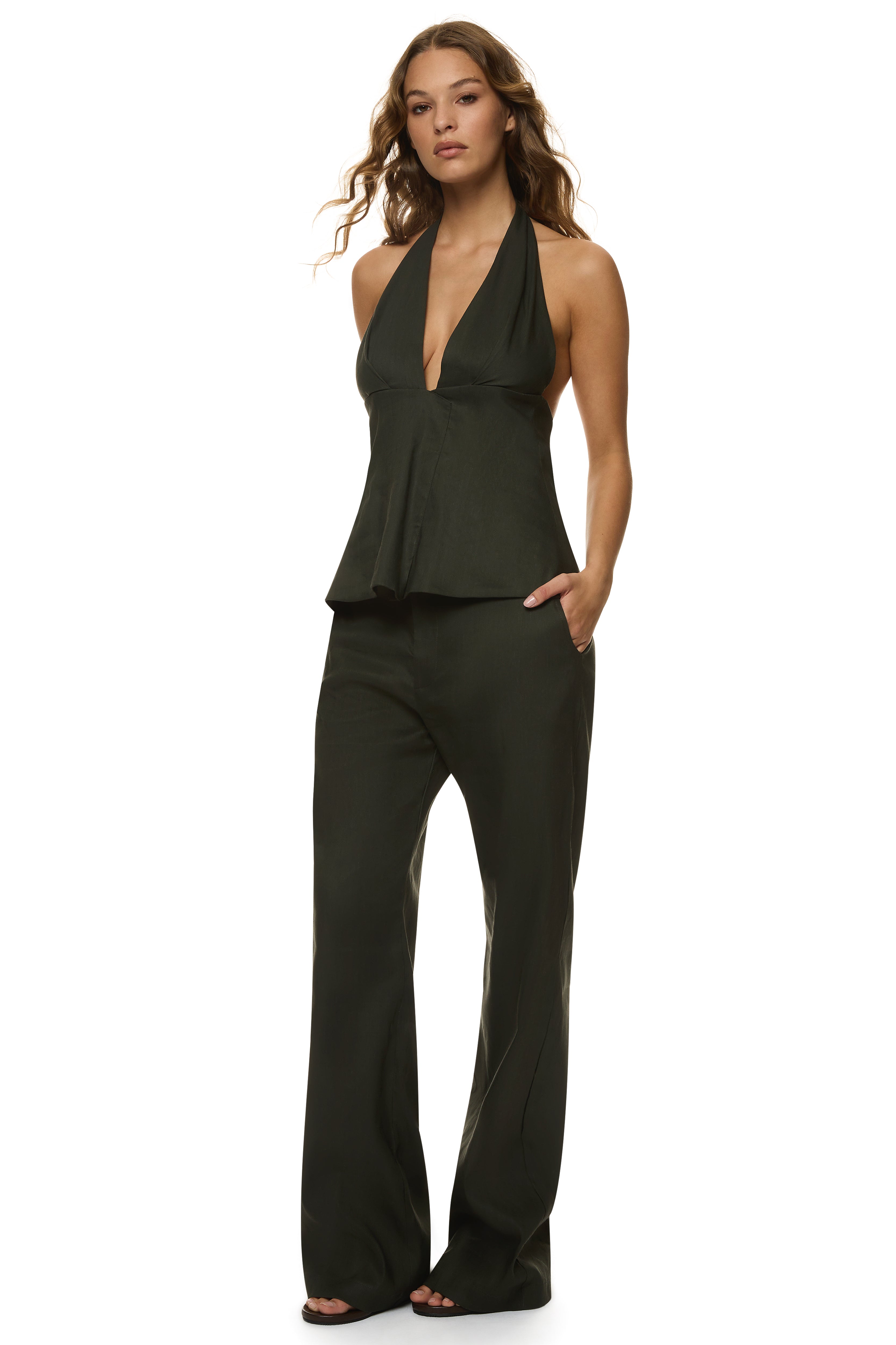 Essential Trouser in linen with wide-leg relaxed silhouette, dual button closure, and matching Linen Halter Top, styled for coastal lunches and resort wear.